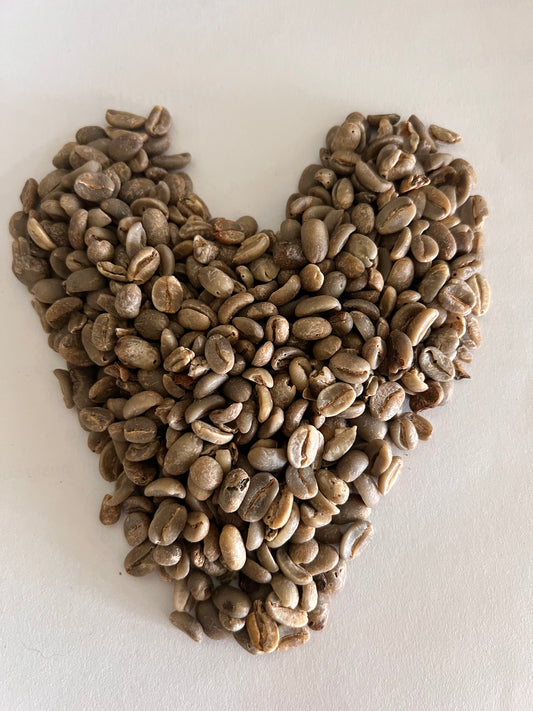 green coffee beans in shape of heart